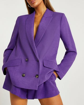 Kate Middleton wears a purple trouser suit by Emilia Wickstead