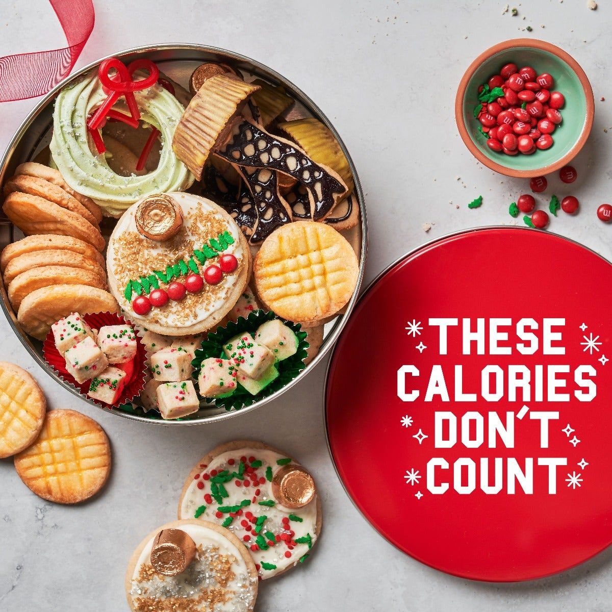 Fill this precious cookie tin with baked goods for a true Christmas treat.&...
