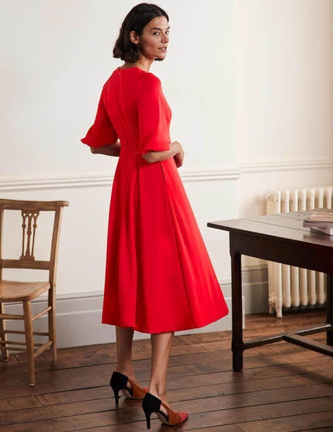 The Duchess of Cambridge looks festive in red at Christmas carol concert