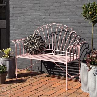 Pretty pink metal garden bench