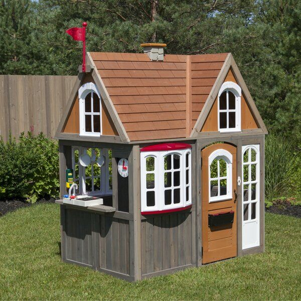 wooden outdoor playhouse with kitchen