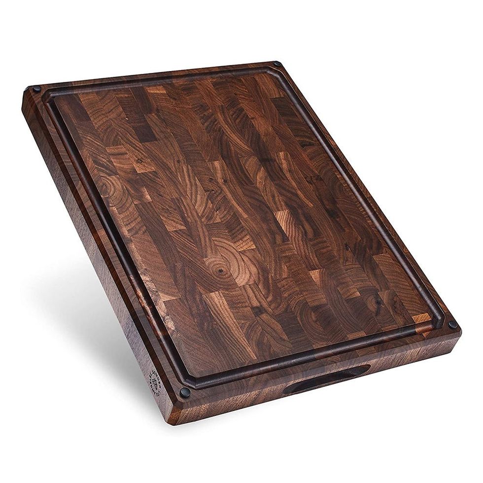 https://hips.hearstapps.com/vader-prod.s3.amazonaws.com/1650992961-large-thick-end-grain-walnut-wood-cutting-board-1650992954.jpg?crop=1xw:1xh;center,top&resize=980:*