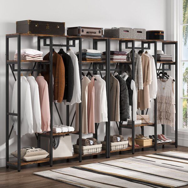 https://hips.hearstapps.com/vader-prod.s3.amazonaws.com/1652373217-freestanding-closet-organizer-systems-with-shelves-open-wardrobe-closet-for-hanging-clothes.jpg?crop=1xw:1.00xh;center,top&resize=980:*