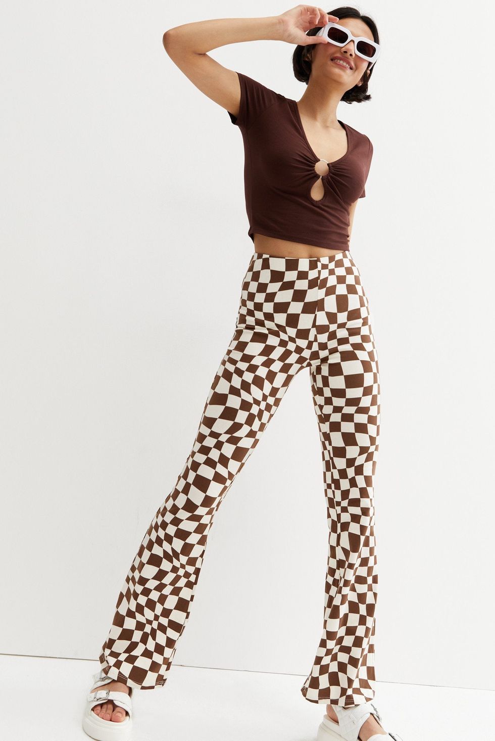 Brown checkerboard flared trousers: festival outfits
