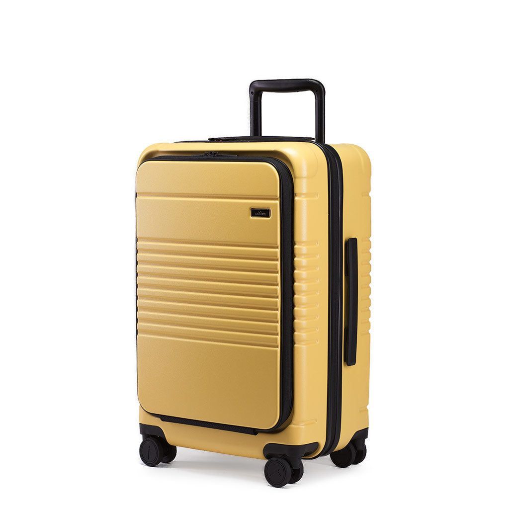 calpak yellow luggage