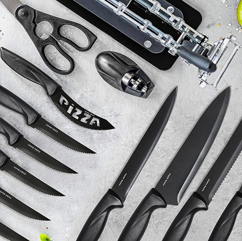 https://hips.hearstapps.com/vader-prod.s3.amazonaws.com/1656356896-new-home-hero-17-pcs-kitchen-knife-set-7-stainless-steel-knives-6-serrated-steak-knives-scissors-peeler-knife-sharpener-with-acrylic-stand-black-stainless-steel-1656356876.jpg?crop=0.575xw:1.00xh;0.187xw,0&resize=980:*