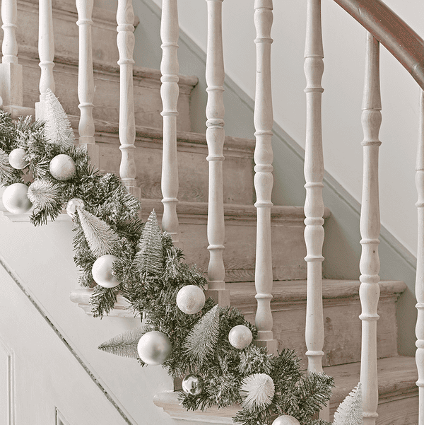 Decorating a Staircase with Honeycomb Balls by The Listed Home