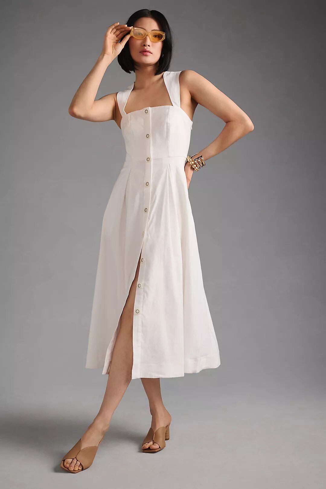 White dress with 2024 buttons on front