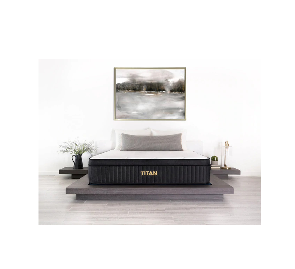the titan plus luxe mattress pictured on a grey wooden bed frame with two end tables 