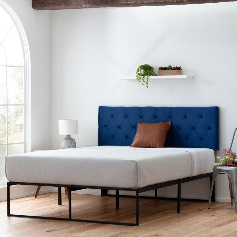 Adjustable bed with mattress and outlet headboard