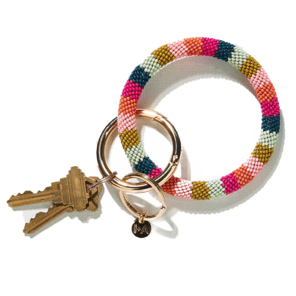 https://hips.hearstapps.com/vader-prod.s3.amazonaws.com/1694652573-pink-citron-peacock-stripe-seed-bead-key-ring-bakr0101ra-32696730058945.png?crop=1xw:1.00xh;center,top&resize=980:*
