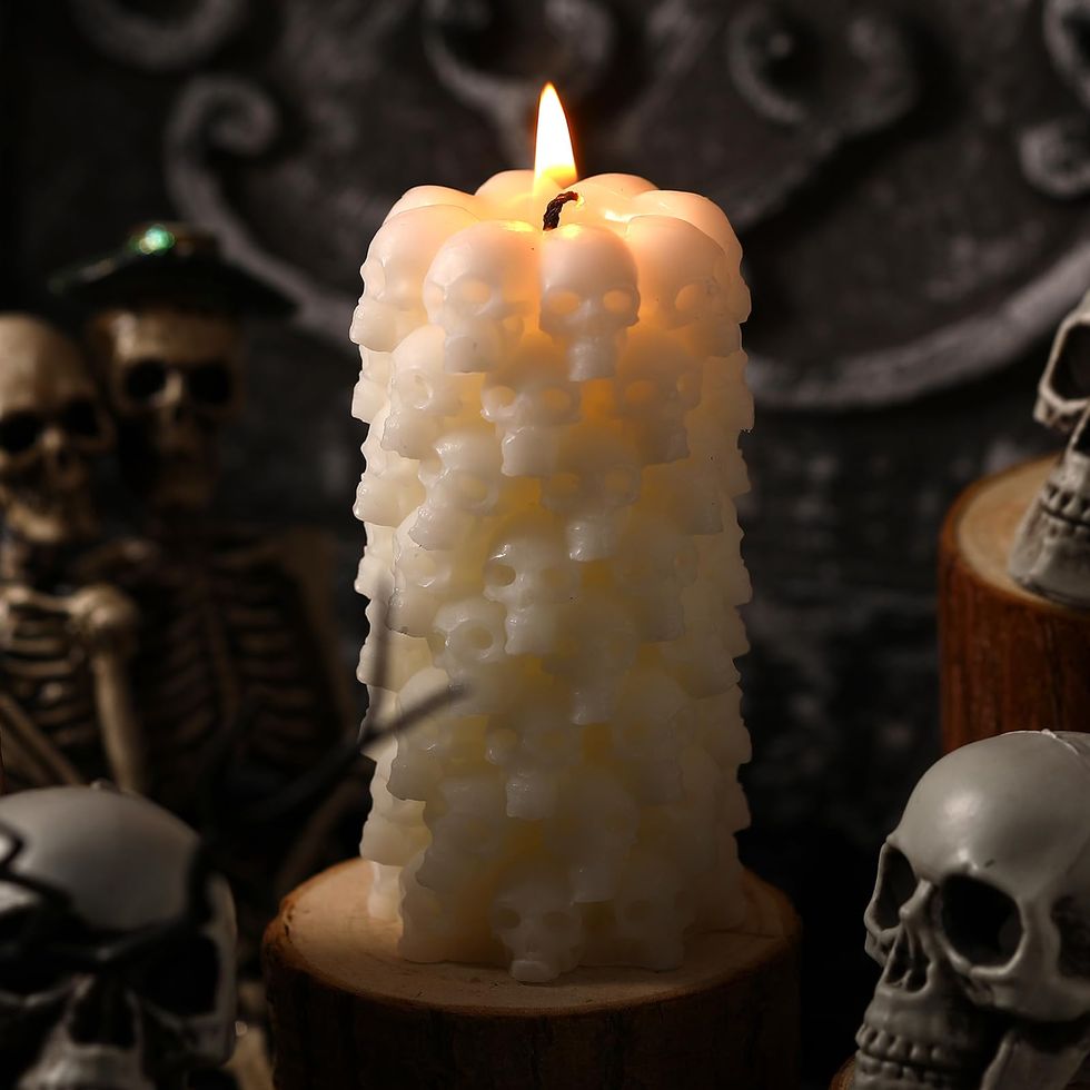 Spooky Halloween Candle on Ancient Skull