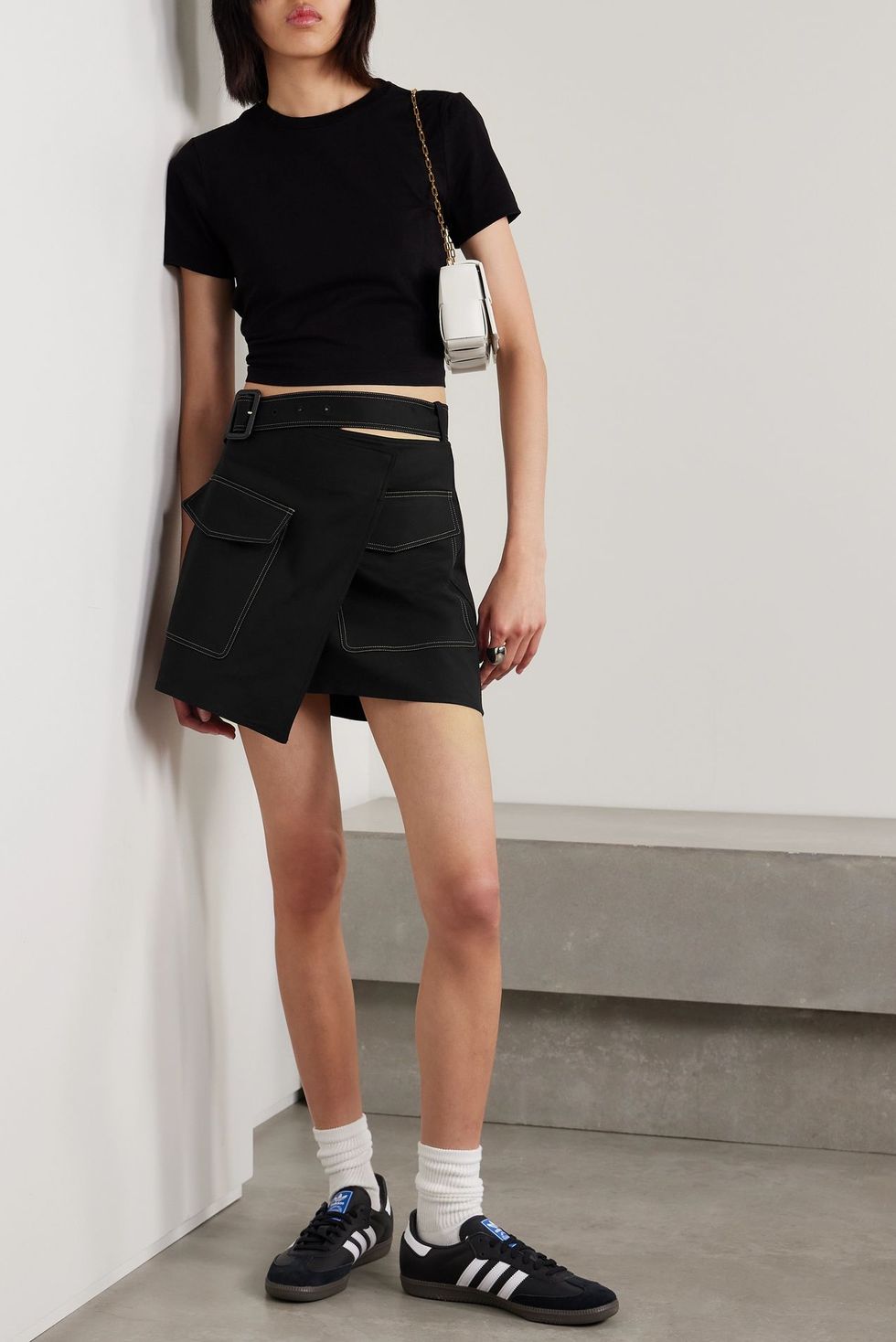https://hips.hearstapps.com/vader-prod.s3.amazonaws.com/1697709432-best-cargo-skirts-helmut-lang-trench-belted-wrap-effect-cotton-blend-mini-skirt-6530fd5171573.jpg?crop=0.928xw:0.927xh;0,0&resize=980:*
