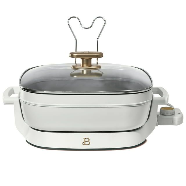 https://hips.hearstapps.com/vader-prod.s3.amazonaws.com/1698788132-Beautiful-5-in-1-Electric-Skillet-Expandable-up-to-7-Qt-with-Glass-Lid-White-Icing-by-Drew-Barrymore_4b6d28e6-949c-4951-876a-51ba1273549d.6fc8ebdeb83c4537e8135f28c54fb209.jpg?crop=1xw:1xh;0xw,0xh