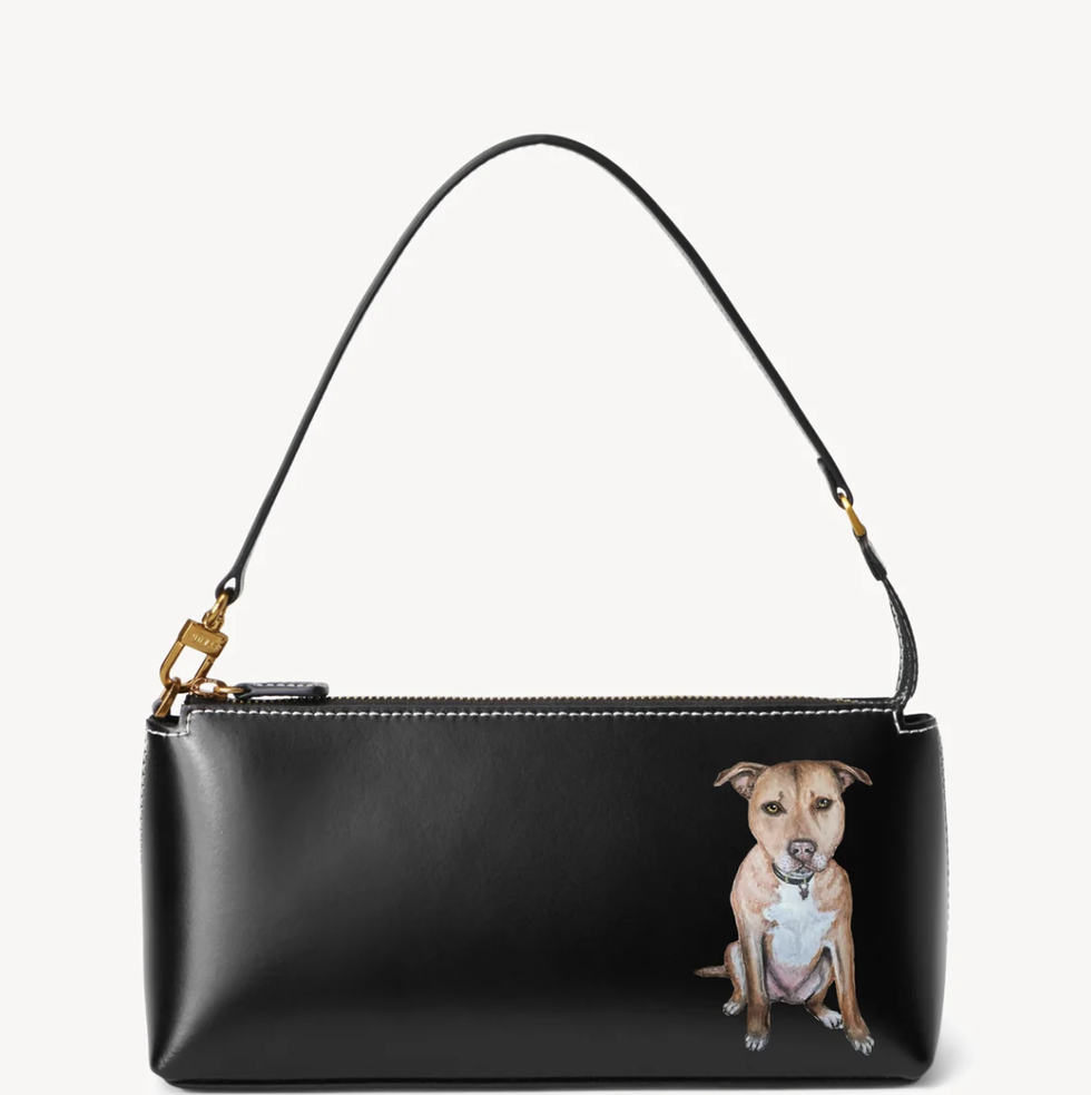 https://hips.hearstapps.com/vader-prod.s3.amazonaws.com/1699626243-best-gifts-for-dog-lovers-staud-bag-654e3cf3ba858.png?crop=1.00xw:0.932xh;0,0.0242xh&resize=980:*