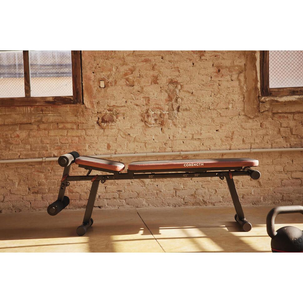 Fold-down incline weight bench with leg bar