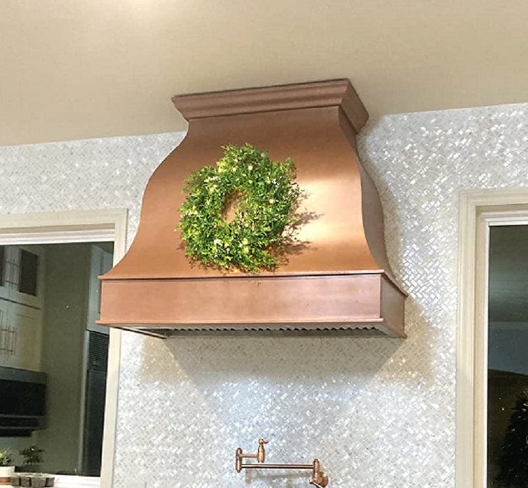 S-shaped hammered copper kitchen hood