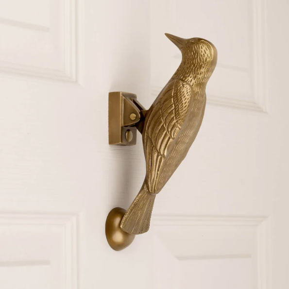 Cosima Woodpecker Door Knocker in Aged Brass