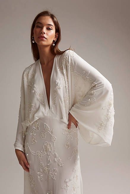 Lisa drape sleeve plunge wedding dress with floral embellishment in