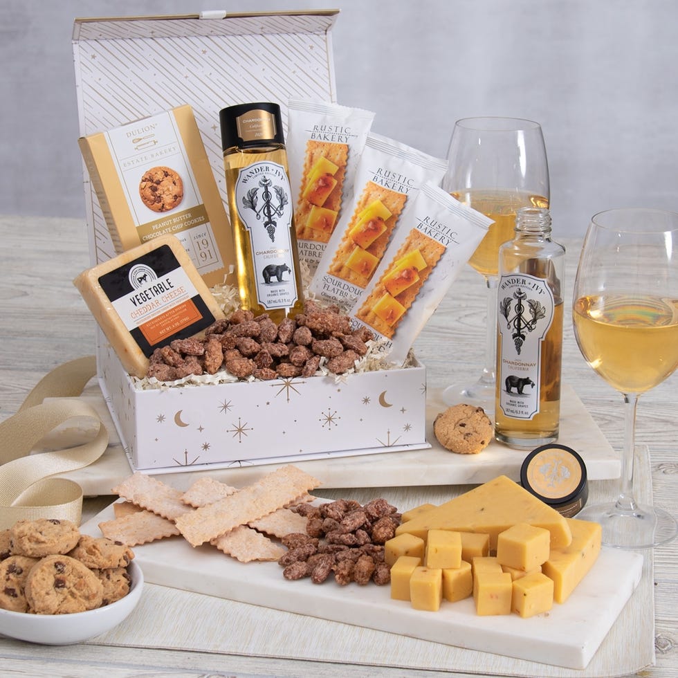 Gift box with white wine, cheese and crackers