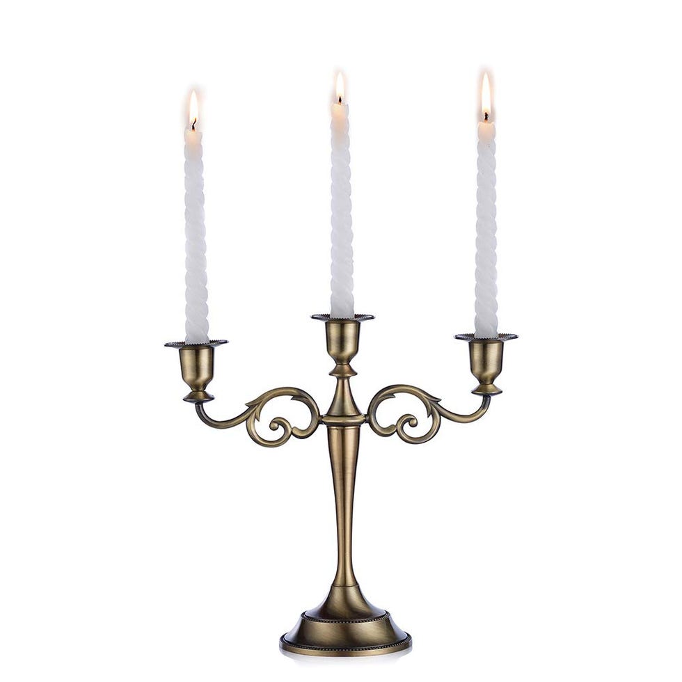 Candelabro con tres cabezas