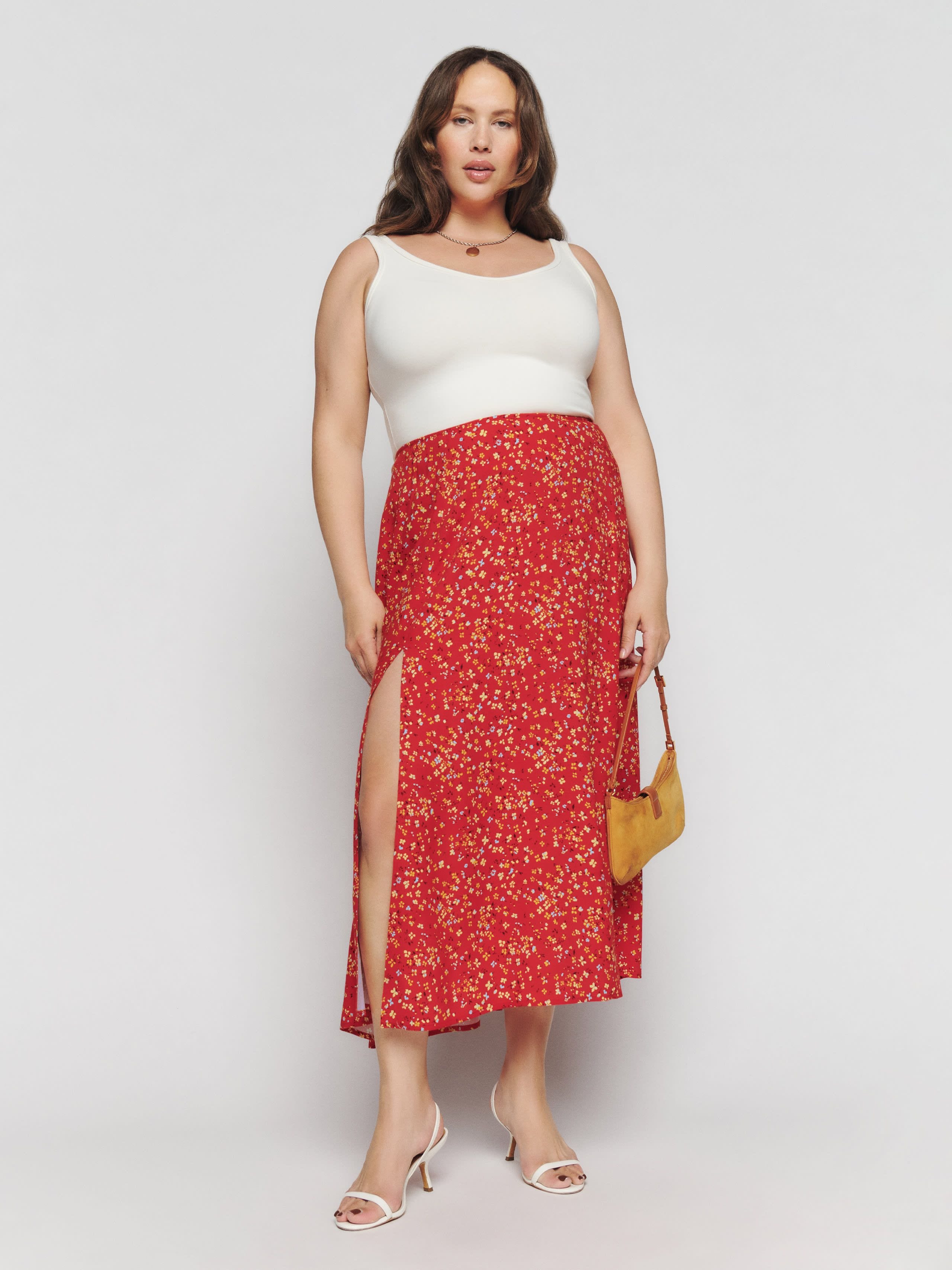 21 best midi skirts to shop 2024 from denim to satin slip styles