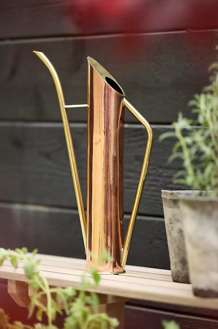 Tall copper and brass watering can