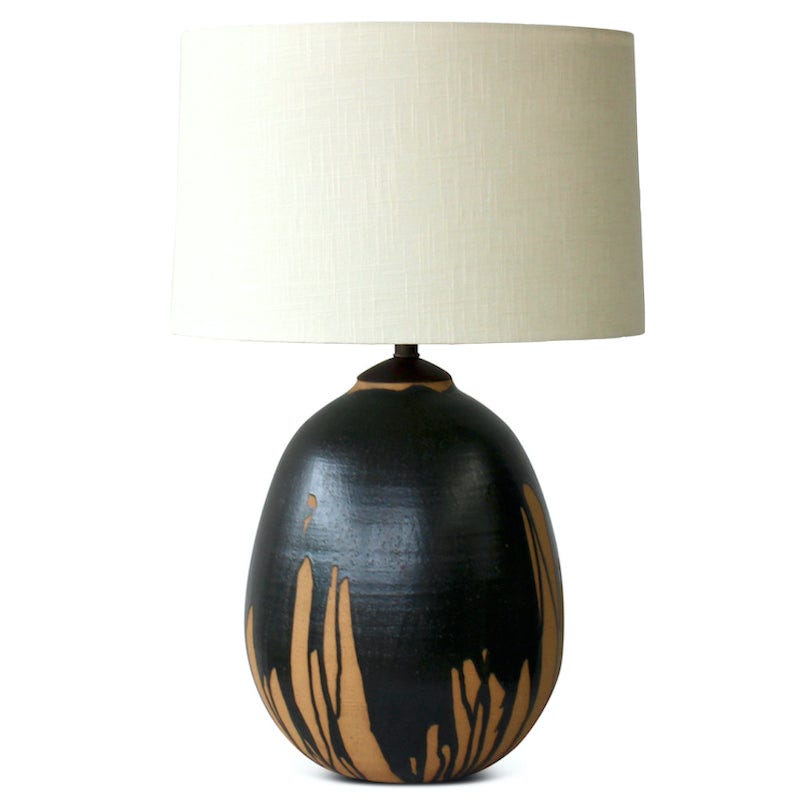 Round black drip lamp made of Natan moss