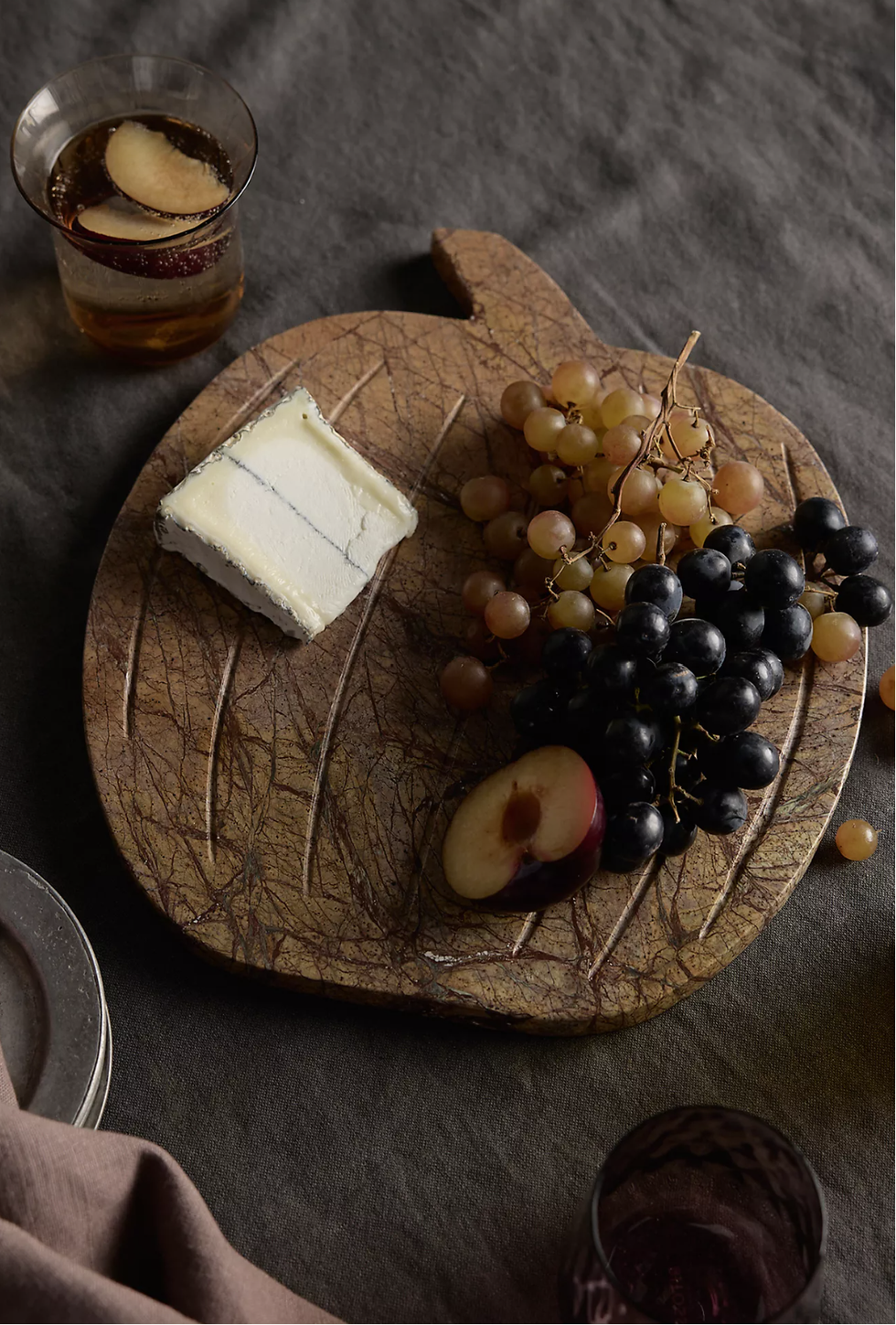 Serving board with pumpkin motif made of brown forest marble