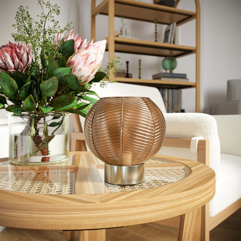 Cordless table lamp made of ribbed glass in amber