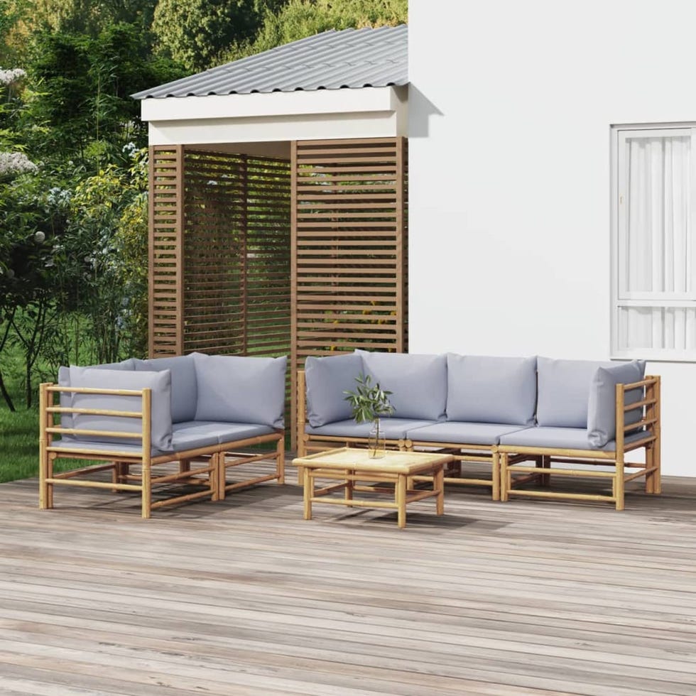 Sofá modular de jardín de bambú con cojines y mesa