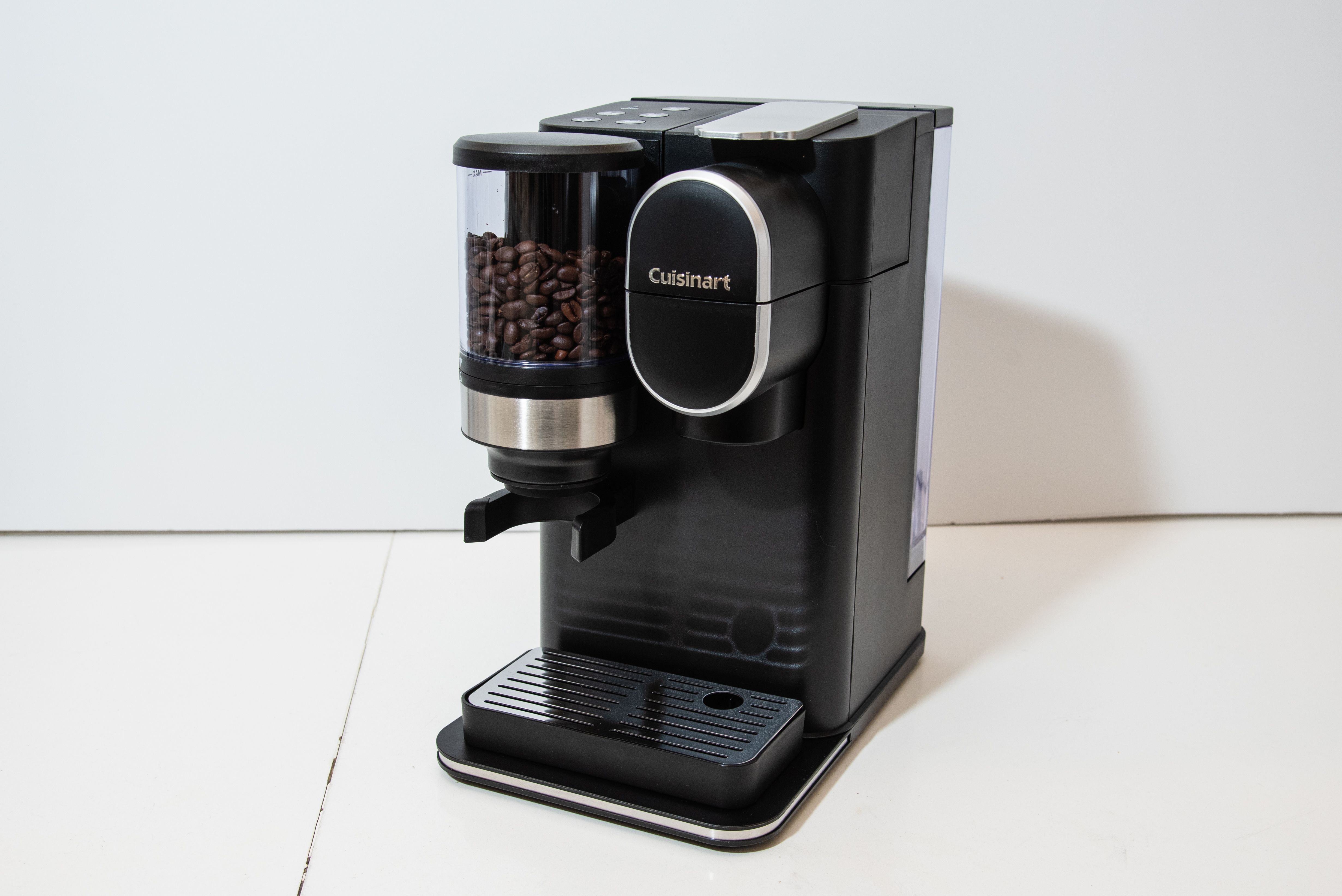 cuisinart grind & brew single serve coffee maker on a white counter