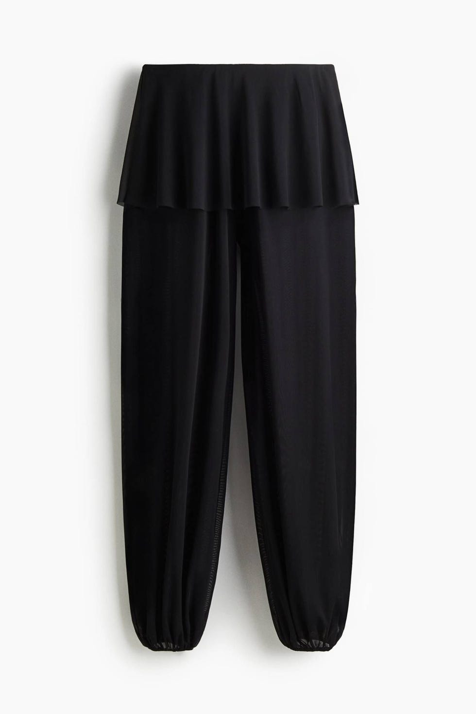 Pantalón de corte holgado en malla vaporosa con minifalda superpuesta