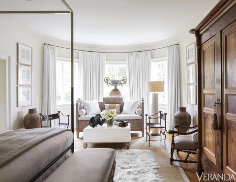 <p>Gustavian daybed in a Libeco linen; coffee table, Tara Shaw Maison; Louis XIV armchair in a Donghia fabric; curtains in a Dedar fabric; sheepskin rug, Chichester, Inc.; sisal rug, Merida; walls in Ivory White, Benjamin Moore; framed intaglios, Tara Shaw for Restoration Hardware.</p>