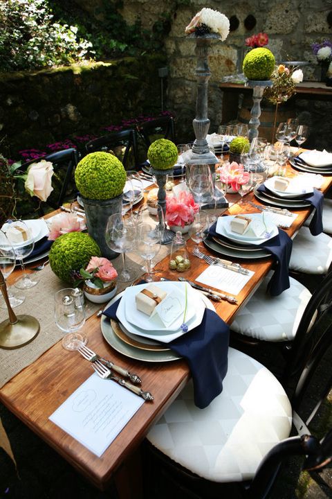 <p>Preserved boxwoods on tiered iron stands give this table, designed by <a href="http://paperista.com/" target="_blank">PAPERISTA</a>, a formal, English-inspired look.</p><p>Via <a href="http://www.stylemepretty.com/california-weddings/sonoma/2011/04/15/sonoma-vow-renewal-by-paperista/" target="_blank">Style Me Pretty</a></p>
