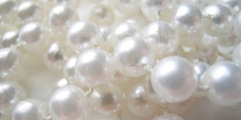 White, Natural material, Ivory, Beige, Silver, Ball, Transparent material, Macro photography, Pearl, Chemical compound, 