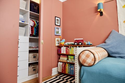 Room, Interior design, Shelving, Shelf, Orange, Furniture, Wall, Pillow, Home, Linens, 