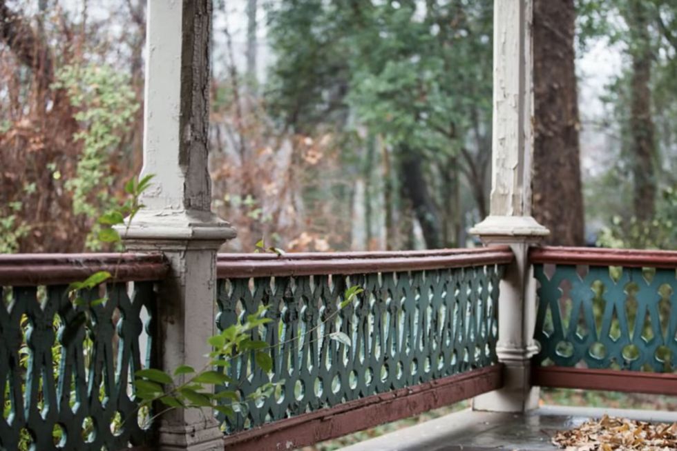 Iron, Guard rail, Baluster, Fence, Tree, Porch, Handrail, Room, Outdoor structure, Home fencing, 
