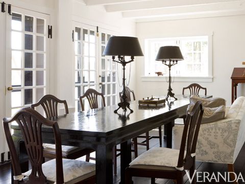 <p>An unusually low ceiling prevented Carter from installing a chandelier in a client's dining room, forcing him to be creative. By using a pair of tall, Baroque-style table lamps instead of a ceiling fixture, he created a different kind of focal point.</p>