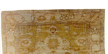 <p>With their loose, large weave, oushaks have become Maloney's go-to floor covering for creating contrast in a formal room.</p>
