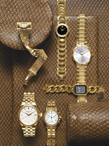Clockwise, from top left: Van Cleef & Arpels' uniquely styled Cadenas watch in yellow gold. Movado's Rondiro watch with black museum dial and 18k goldplated stainless steel case. Piaget's classic round Dancer watch in 18k yellow gold. Chanel's 18k gold Premier watch. Breguet's Marine Chronograph with 18k yellow gold case and bracelet. Patek Philippe's 18k gold Calatrava watch with opaline white dial. background: Edelman Leather's aniline-dyed cowhide "Old Rattlesnake."