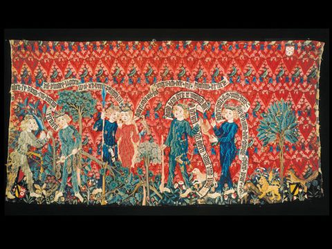 This tapestry-as-frieze, made in 1468 in Switzerland and now in the Historisches Museum Basel, is a fine example of medieval tapestry. Figures are hunting, tending trees and courting.