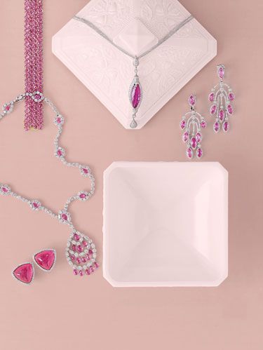 <p>A deep-pink rubellite is really a red tourmaline.</p><p>Clockwise from Top Left: <a href="http://www.paolocostagli.com"target="_blank">Paolo 
			Costagli's</a> oval pink sapphire, 76.37 carats, bracelet in 18k gold. <a href="http://www.donaldhuber.com"target="_blank">Donald Huber's</a> 
			one-of-a-kind  Slick Collection pendant with 11.25-carat rubellite and diamonds in 18k white gold. Pink sapphire, 28.40 
			carats, and diamond, 6.02 carats, chandelier earrings from <a href="http://www.chopard.com"target="_blank">Chopard</a>. Graff's necklace with pink 
			sapphire briolettes, 30.14 carats, and diamonds, 30.32 carats, in platinum. <a href="http://www.valentinmagro.com"target="_blank">Valentin Magro's</a> 			carved pink tourmaline and pavé diamond earrings. 

