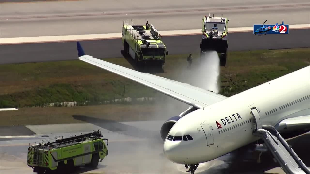 WATCH: Firefighters extinguish fire reported on Delta plane at Orlando International Airport