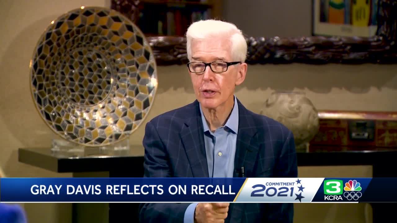 California Gov. Gray Davis laughs as he holds up a jersey of