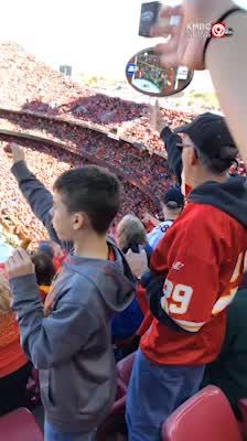 October 30, 2017: A Kansas City Chiefs fan in his Chiefs headdress does the tomahawk  chop during the NFL Football Game between the Denver Broncos and the Kansas  City Chiefs at Arrowhead