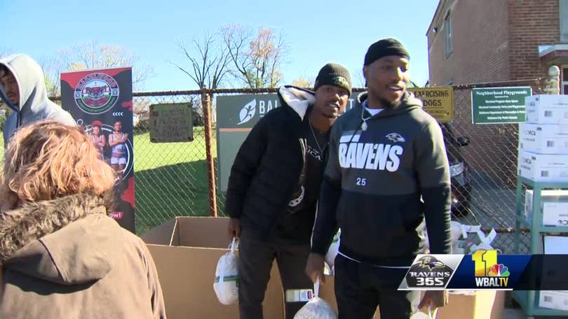 Ravens players hand out Thanksgiving food to Baltimore families