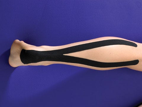achilles muscle injury on running outdoors. senior man holding knee by hands and suffering with pain. sprain ligament.