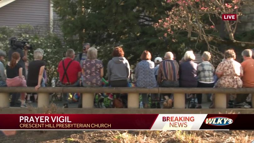 Community members gather at site of Louisville mass shooting, pay