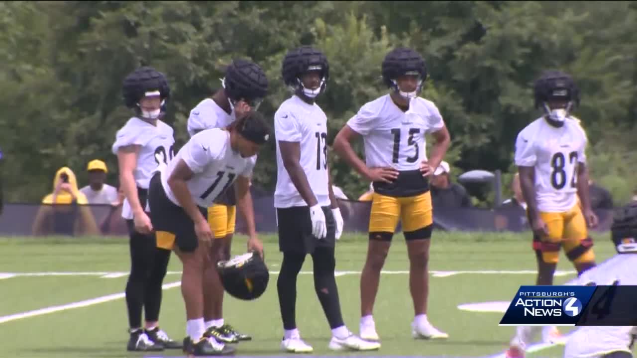 Steelers players wearing caps at training camp